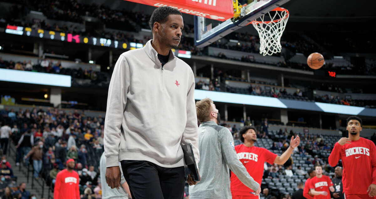 Houston Rockets head coach Stephen Silas heads to the bench for the first half of an NBA basketball game against the Denver Nuggets Friday, March 4, 2022, in Denver. (AP Photo/David Zalubowski)