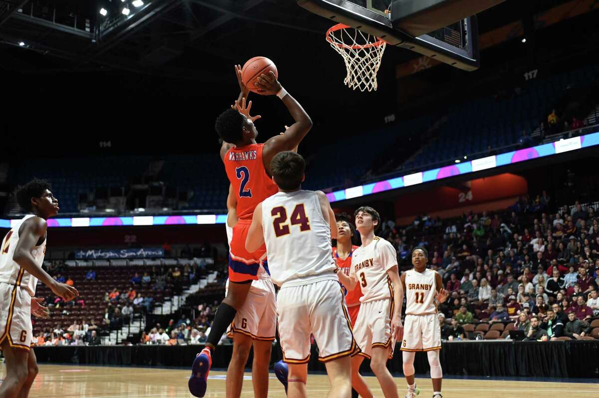 Bloomfield's Howard Simpson goes up for a basket during action of the CIAC Div IV Basketball Championship between Bloomfield and Granby on Sunday March 20, 2022 played at Mohegan Sun Arena in Uncasville, CT.