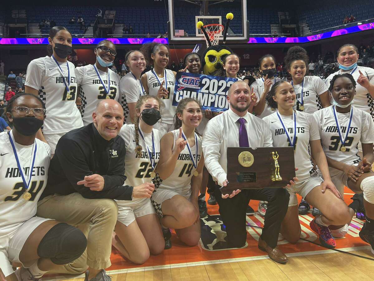East Hartford celebrates after beating Wilton in the Class LL girls basketball championship on Sunday at the Mohegan Sun Arena.