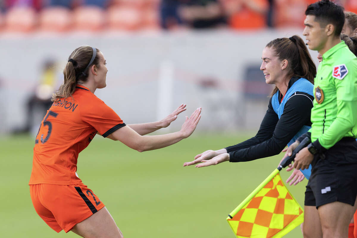 Houston Dash defender Katie Naughton (25) celebrates her goal with the bench against the Chicago Red Stars in the first half at PNC Stadium on March 20, 2022 in Houston.