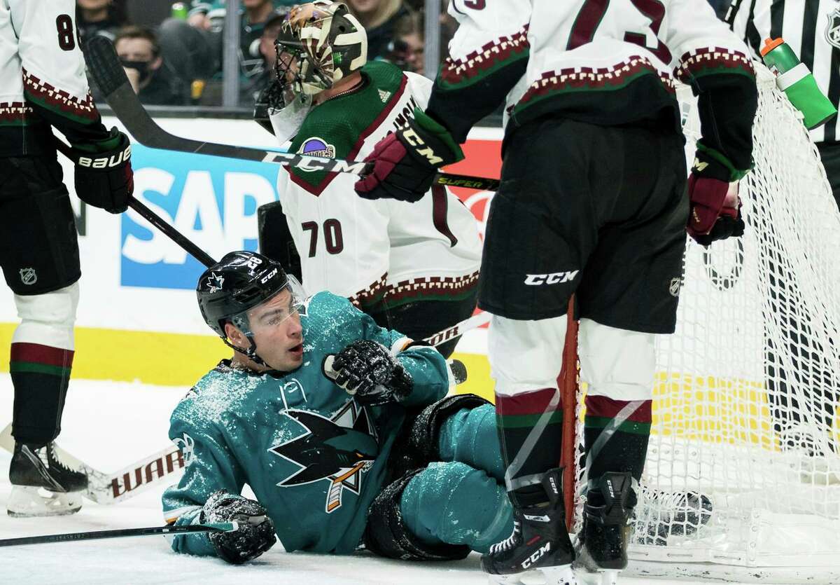 The Sharks’ Timo Meier collides with Coyotes goalie Karel Vejmelka during the first period.