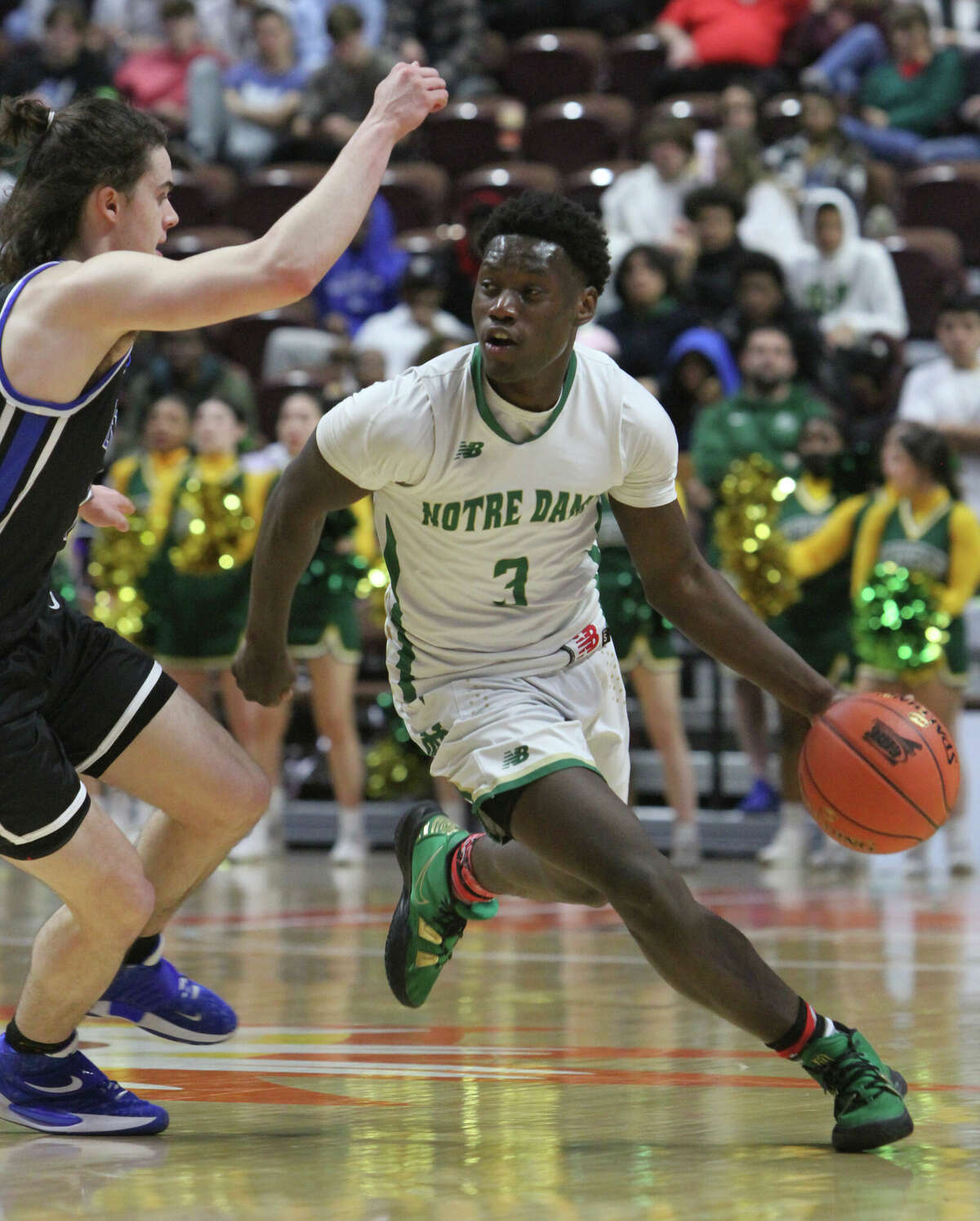 Notre Dame-West Haven's Mekhi Conner drives against East Catholic during the CIAC 2022 State Boys Basketball Tournament Division I Finals at the Mohegan Sun Arena on March 20, 2022 in Uncasville, Connecticut. East Catholic won 50-49.