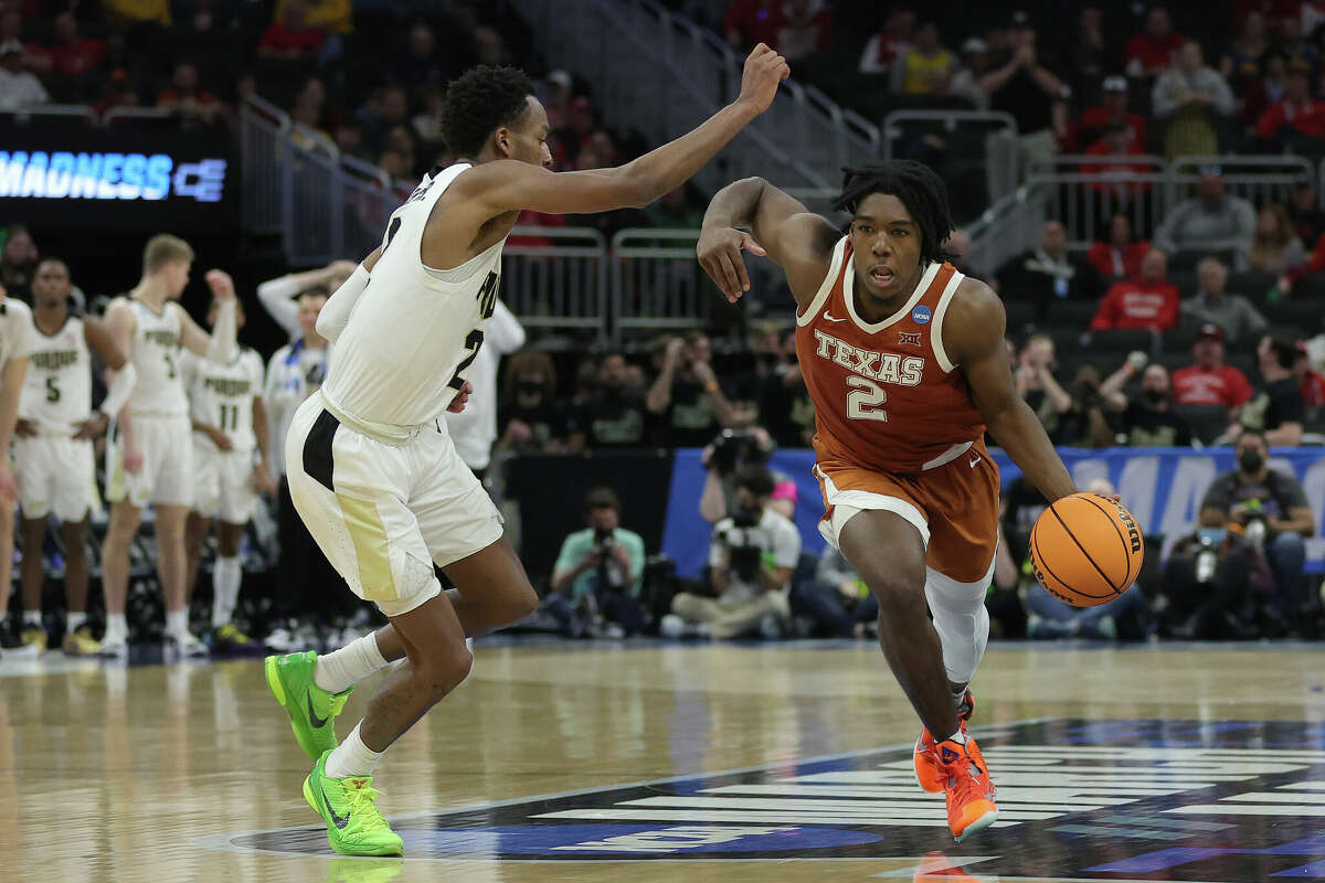 MILWAUKEE, WISCONSIN - MARCH 20: Marcus Carr #2 of the Texas Longhorns dribbles the ball in front of Eric Hunter Jr. #2 of the Purdue Boilermakers during the second half in the second round of the 2022 NCAA Men's Basketball Tournament at Fiserv Forum on March 20, 2022 in Milwaukee, Wisconsin. (Photo by Stacy Revere/Getty Images)