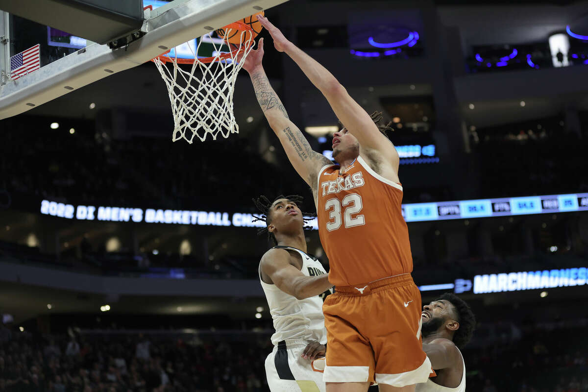 MILWAUKEE, WISCONSIN - MARCH 20: Christian Bishop #32 of the Texas Longhorns dunks the ball during the second half against the Purdue Boilermakers in the second round of the 2022 NCAA Men's Basketball Tournament at Fiserv Forum on March 20, 2022 in Milwaukee, Wisconsin. (Photo by Stacy Revere/Getty Images)