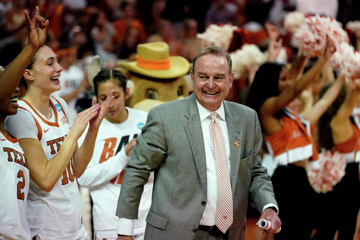 Texas head coach Vic Schaefer, center, celebrates his team's win over Utah in a college basketball game in the second round of the NCAA women's tournament.