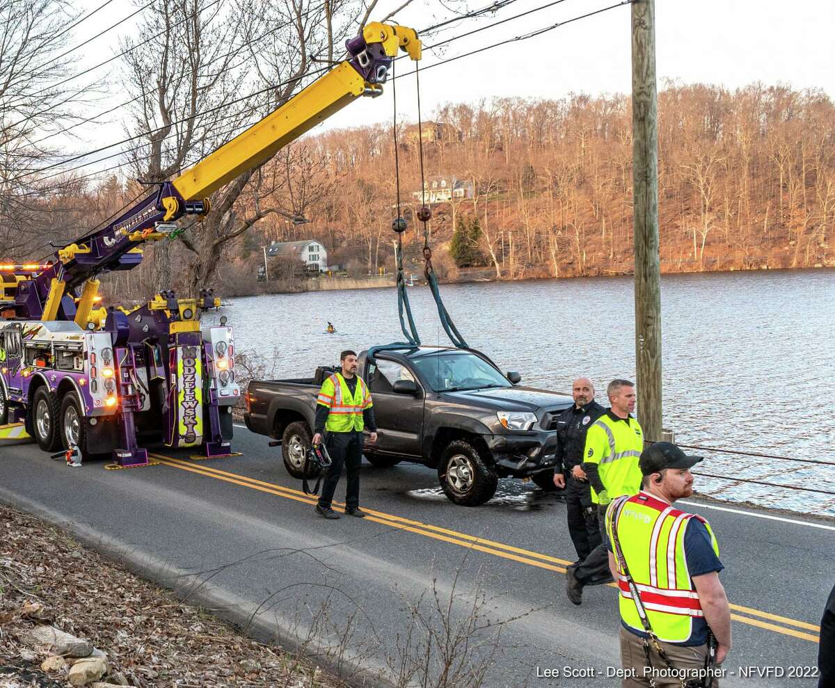 A driver self-extricated after crashing their vehicle into Ball Pond Lake in New Fairfield , Conn., on Sunday, March 19, 2022, according to fire officials.
