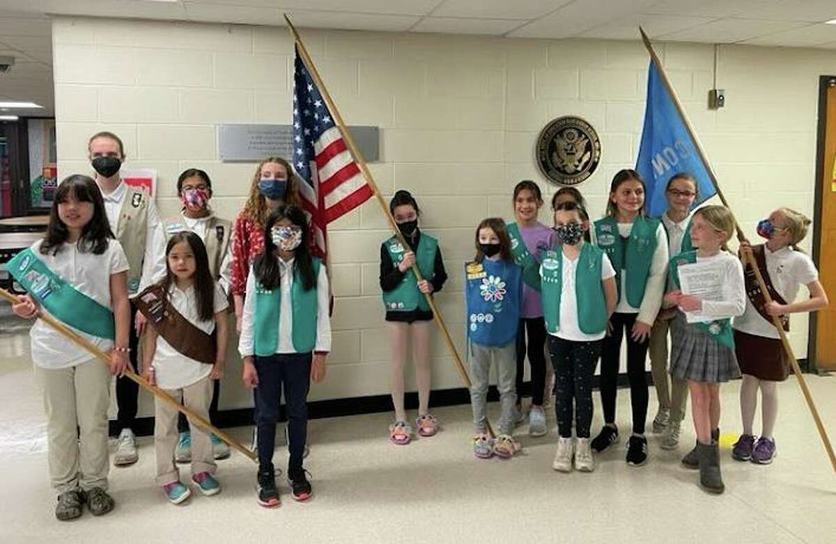 Girl Scouts from Greenwich prepare to serve as the color guard at the meeting of the Greenwich Representative Town Meeting on Monday, March 14, at Central Middle School.