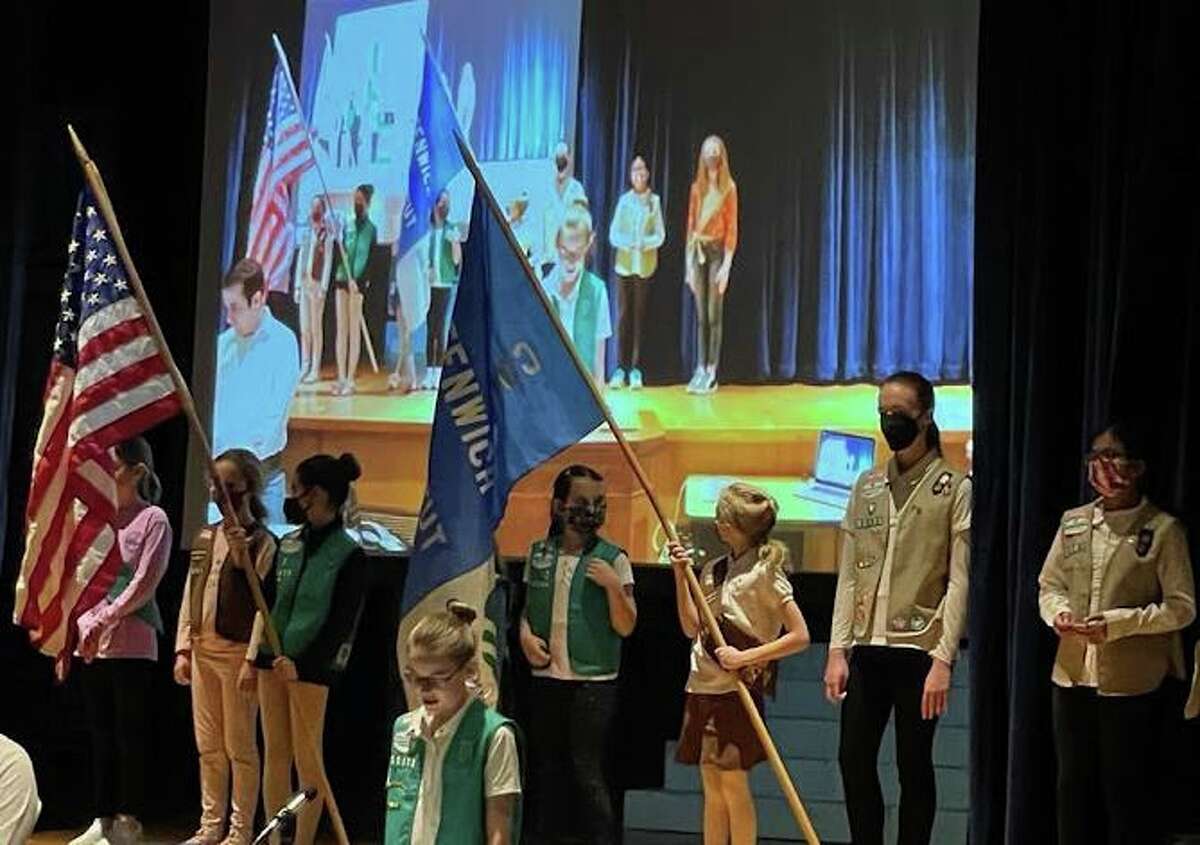 Girl Scouts from Greenwich serve as the color guard at the meeting of the Greenwich Representative Town Meeting on Monday, March 14, at Central Middle School.
