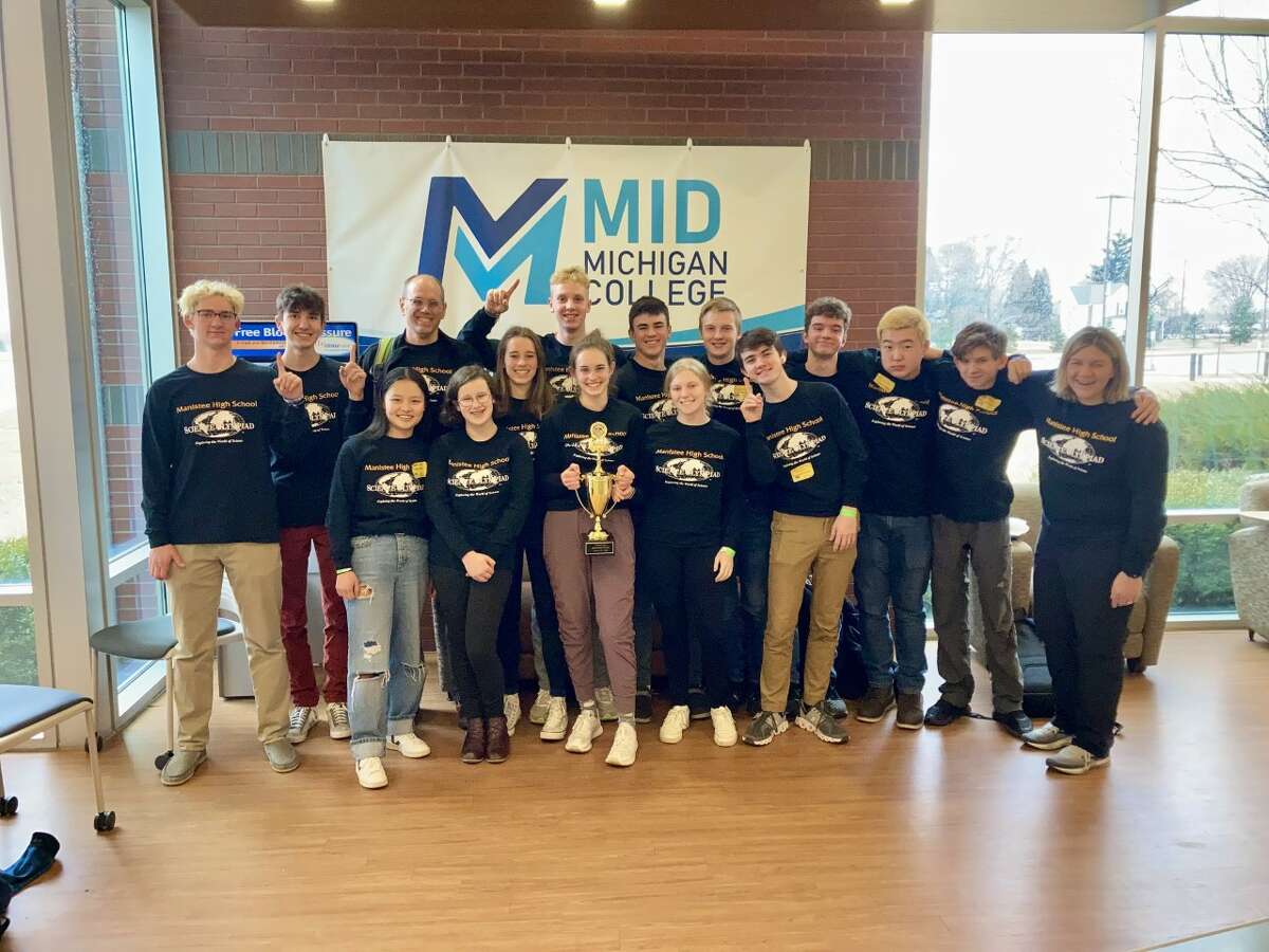 The Manistee High School Science Olympiad team poses for a photo with the regional trophy it captured Saturday at Mid Michigan College in Mount Pleasant.
