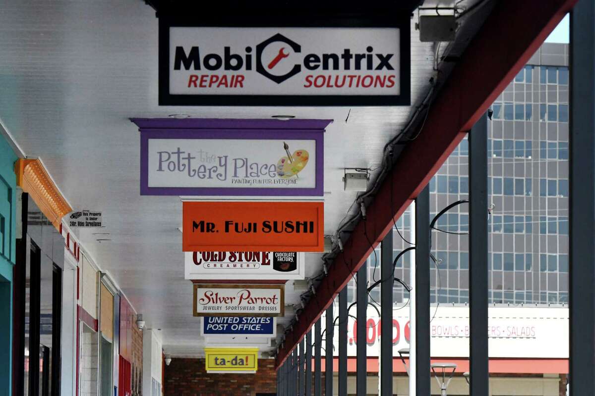 Store signs for businesses at Stuyvesant Plaza on Monday, March 21, 2022, in Guilderland, N.Y.