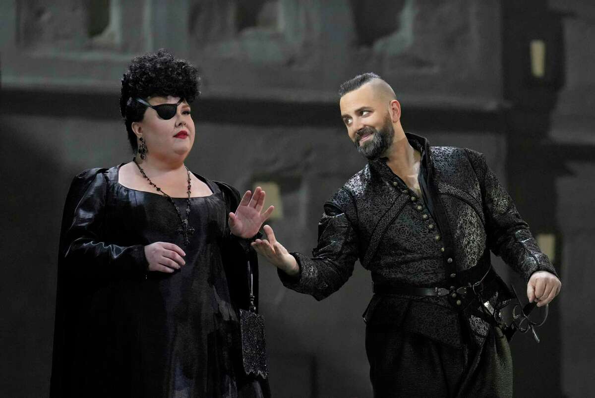 This image released by the Metropolitan Opera shows Jamie Barton as Princess Eboli, left, and Etienne Dupuis as Rodrigue in Verdi's "Don Carlos." The Metropolitan Opera is presenting the original French version for the first time starting Monday.