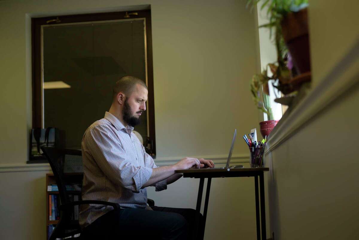Douglas Roest-Gyimah, CEO of Upstate Counseling, works at his practice on Monday, March 21, 2022, in Albany, N.Y. (Paul Buckowski/Times Union)