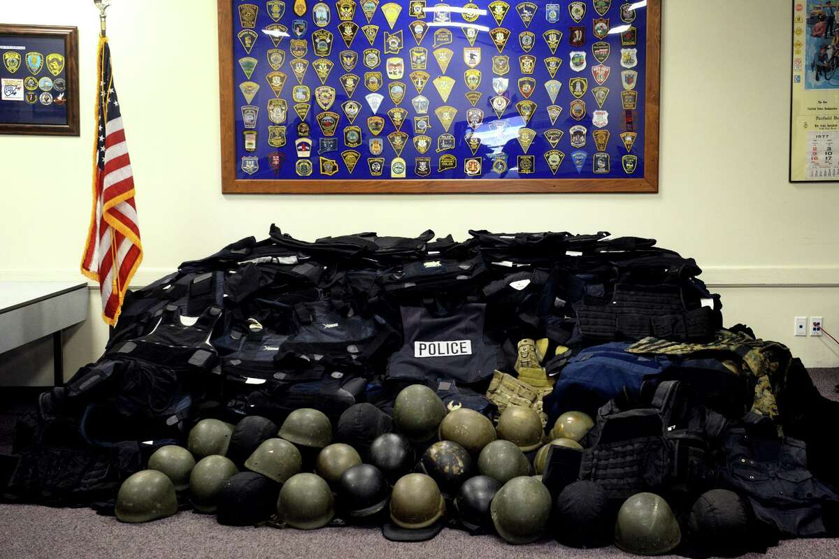Numerous police departments around Fairfield County have collected dozens of older police body armor and helmets that will be donated to defense efforts in Ukraine, seen here on display at Police Headquarters in Fairfield, Conn. March 21, 2022.