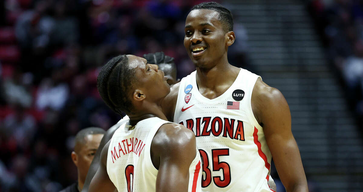Christian Koloko #35 and Bennedict Mathurin #0 of the Arizona Wildcats celebrate during the second round game of the 2022 NCAA Men's Basketball Tournament on March 20, 2022 in San Diego.
