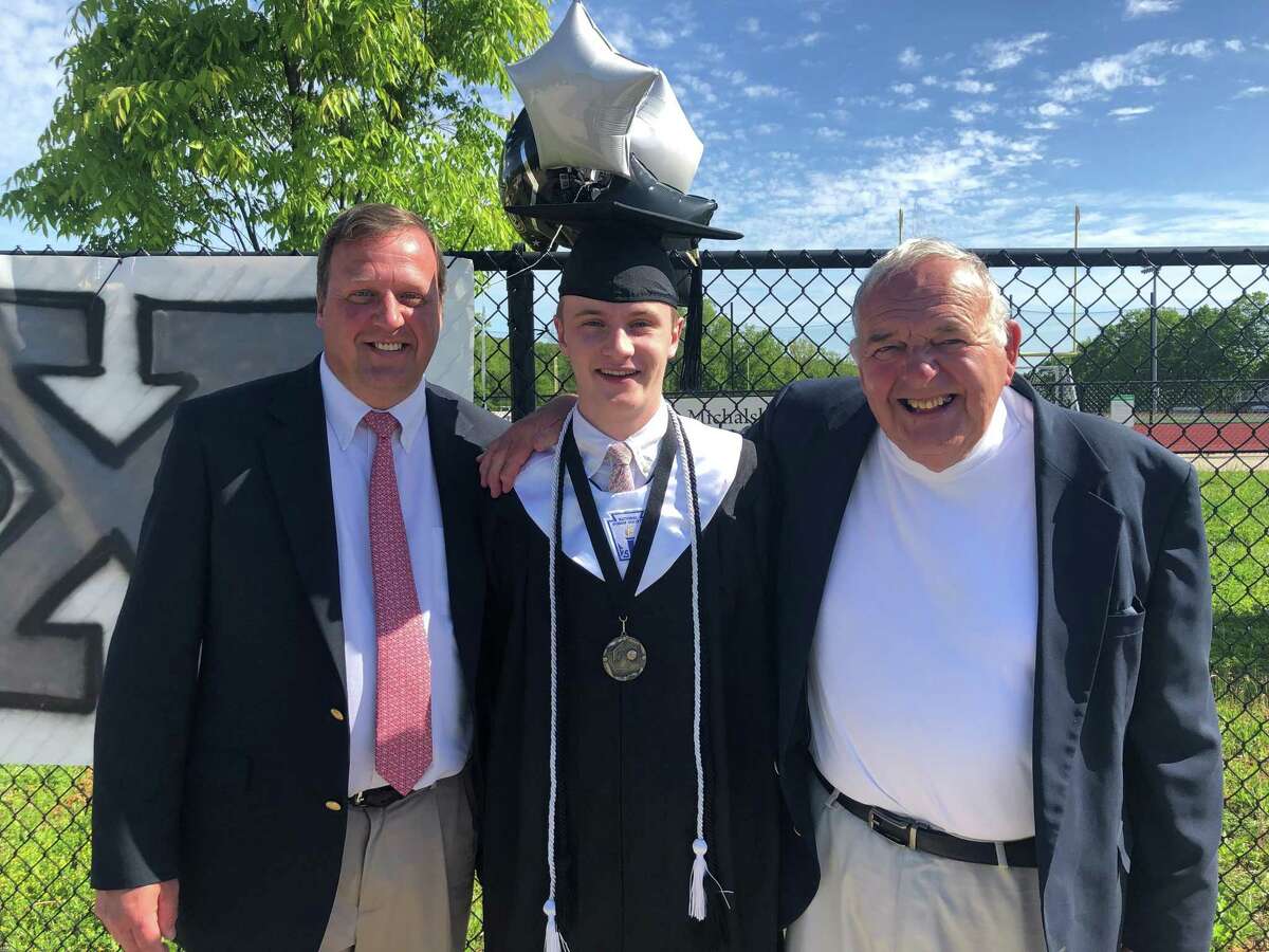 Mike Kohs, left, with son Stephen and father Art Kohs during Xavier graduation ceremonies.