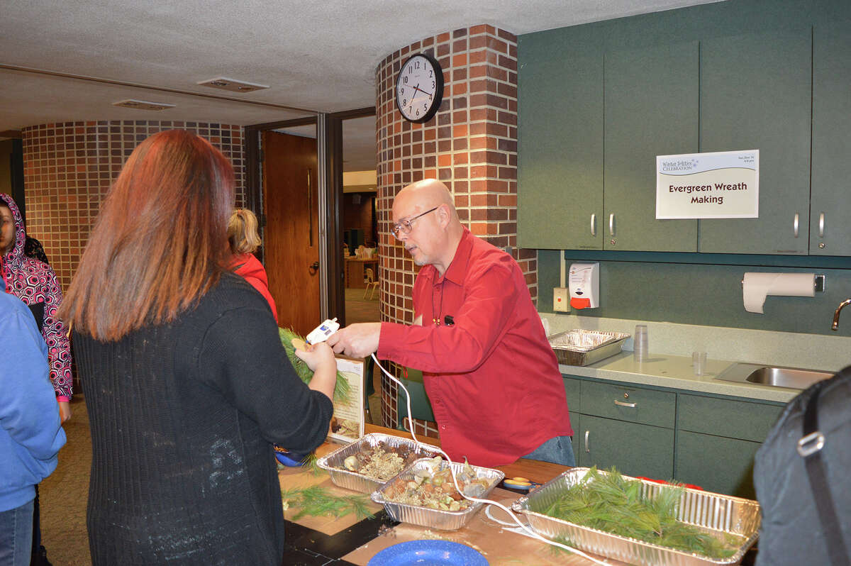 Chippewa Nature Center volunteer Rob Maxwell offers his time at the Winter Solstice Celebration.