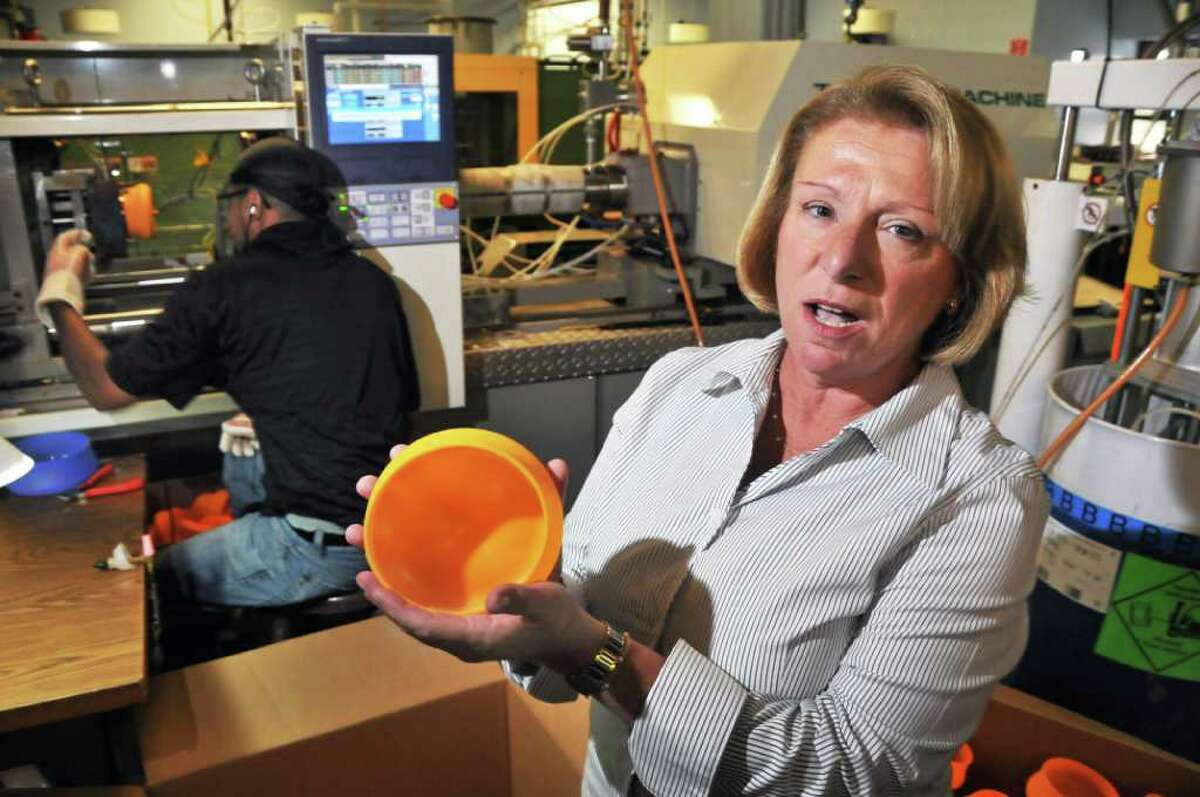 Co owner of Extreme Molding, Joanne Moon with one of her company's "Squishy Bowls" at their Watervliet Arsenal plant Tuesday morning September 28, 2010. (John Carl D'Annibale / Times Union)