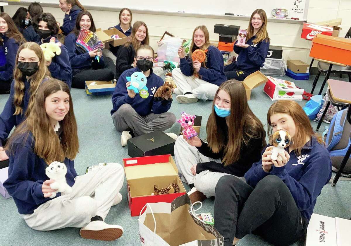 Mercy High School Students Assemble 500 Boxes Of Toys, Clothes For 