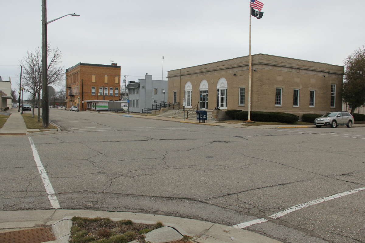 Bad Axe changing stop signs on Woodworth Street