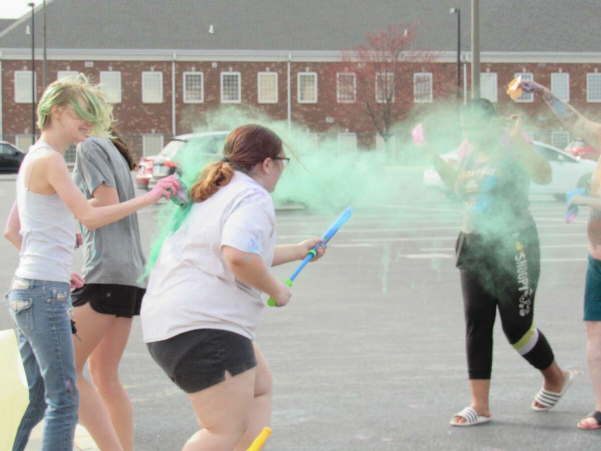 EHS students Kommineni and Caroline James organized a Holi festival in the EHS parking lot to support the national nonprofit Making a Difference One Step at a Time. 