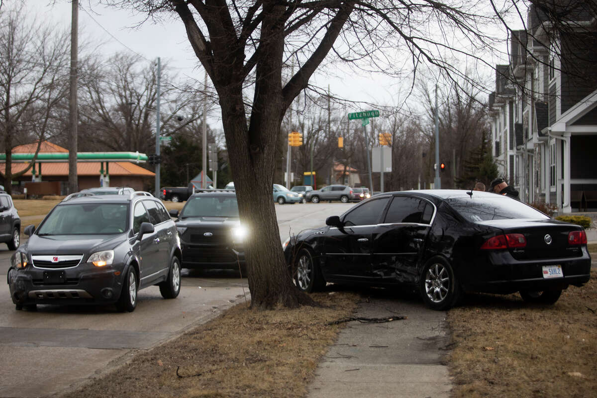 Officers with the Midland Police Department investigate a collision involving two vehicles at the intersection of Buttles and Fitzhugh Streets Tuesday, March 22, 2022 in Midland.