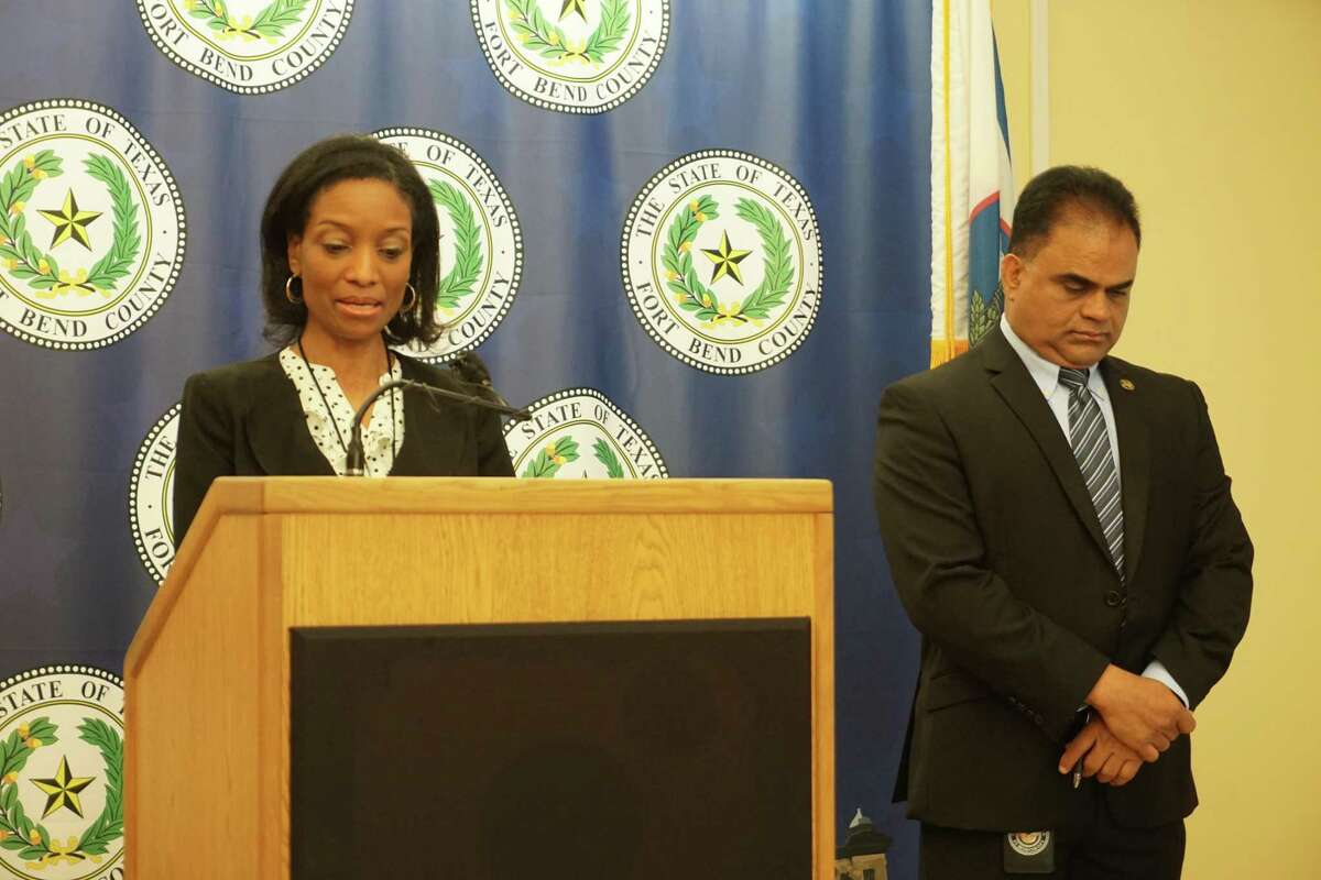 Dr. Jacquelyn Johnson-Minter, Fort Bend County Health & Human Services director, addresses reporters during a news conference on Monday, March 21 where County Judge KP George, right, announced he was lowering the county’s COVID-19 community risk level from yellow to green.