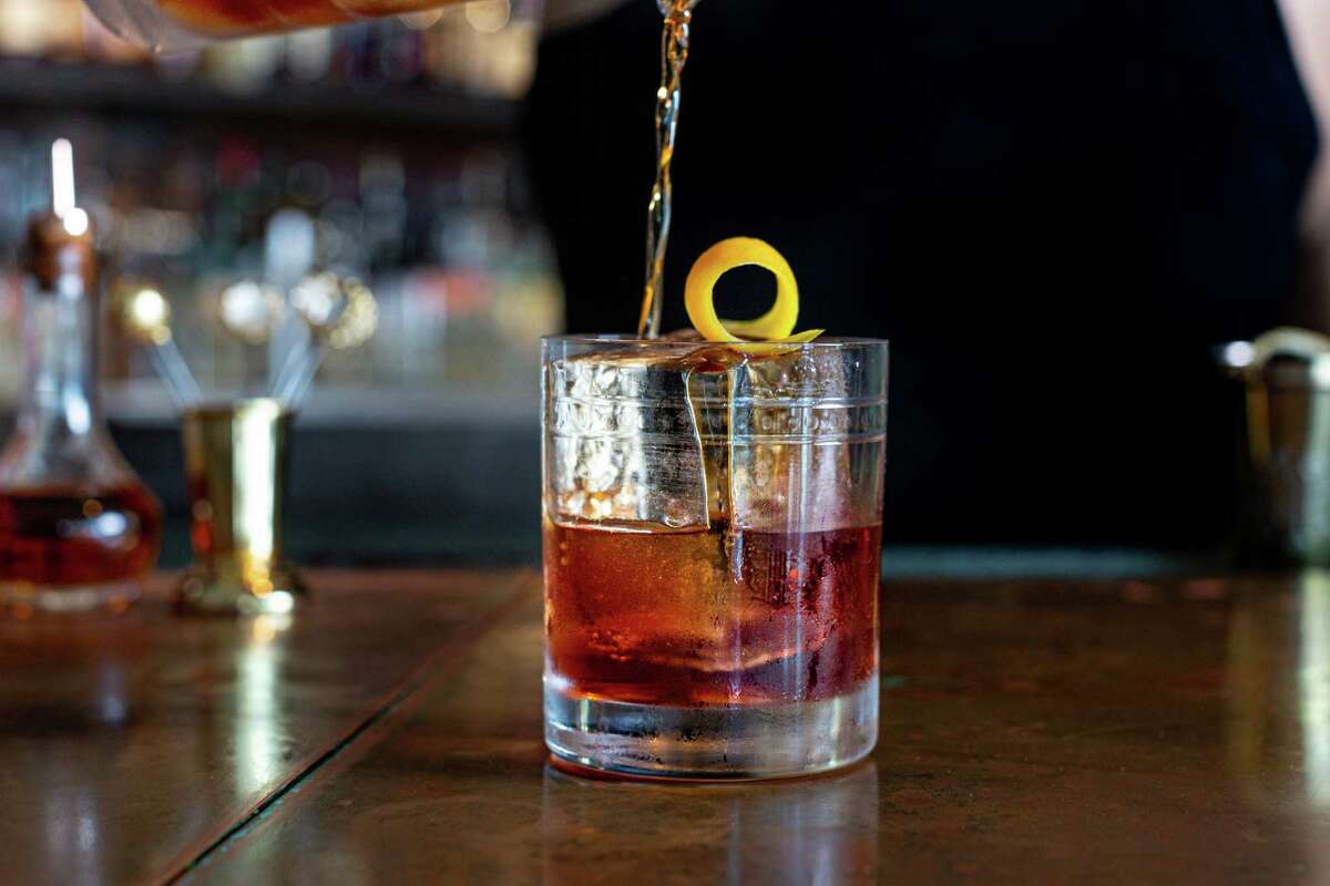 The New Vieux, a remake of the classic Vieux Carre is made with rye whiskey, Venezuelan rum, alligator pepper-infused sweet vermouth, amaro, and bitters, is served at Julep bar, Houston