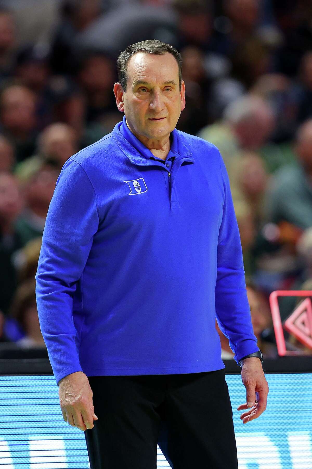 Head coach Mike Krzyzewski of the Duke Blue Devils looks on against the Cal State Fullerton Titans during the second half in the first-round game of the 2022 NCAA Men's Basketball Tournament at Bon Secours Wellness Arena on March 18, 2022, in Greenville, South Carolina. (Kevin C. Cox/Getty Images/TNS)