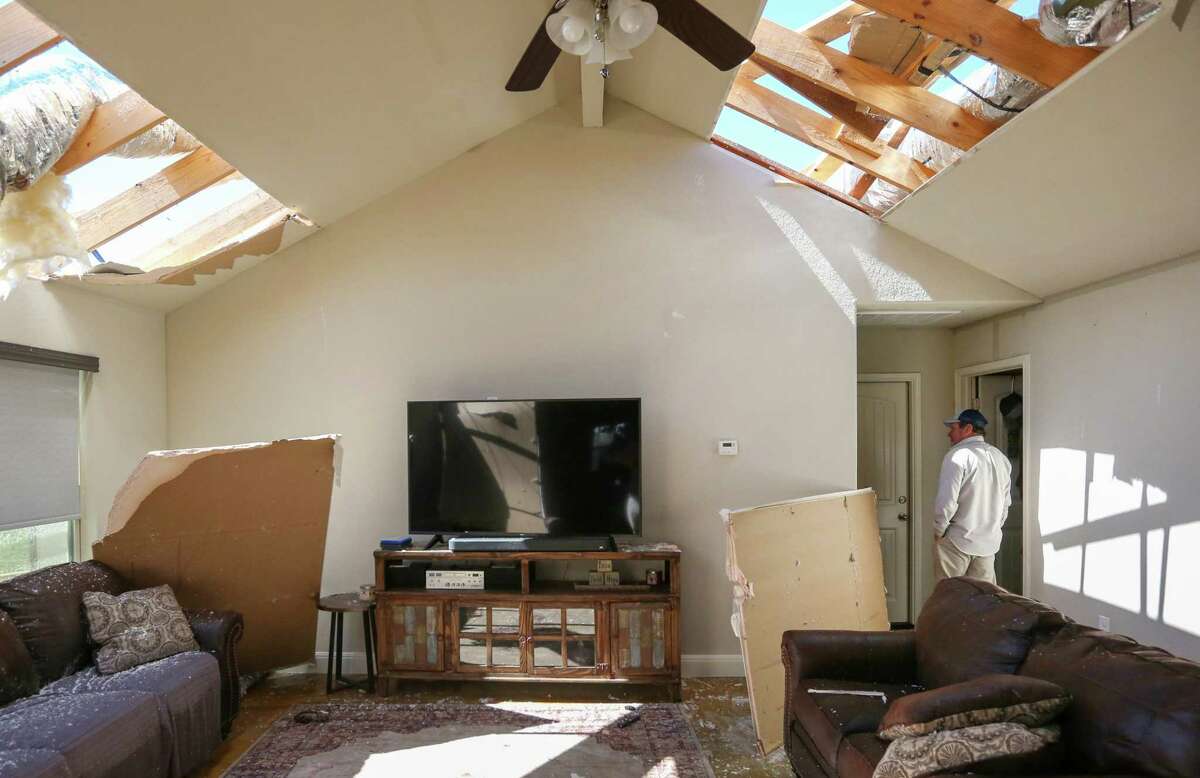 Ronny Holcomb walks Tuesday, March 22, 2022 in his tornado-damaged Kingsbury-area home in Guadalupe County east of Seguin. Kingsbury was under a tornado warning between 5:45 and 6:15 p.m Monday.