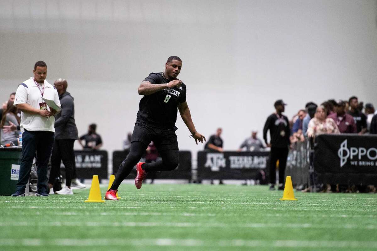 Defensive lineman DeMarvin Leal, a former Judson star, runs the three-cone drill at A&M’s pro day for NFL scouts Tuesday.