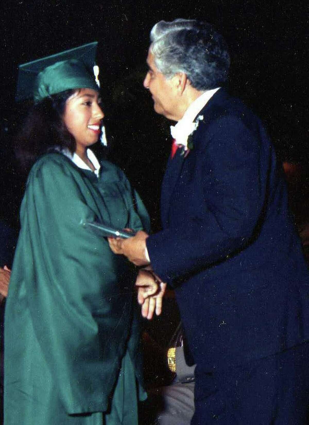 Patty Rodriguez receiving her Kennedy High School diploma from her father in 1990. Because she was the last Rodriguez child to graduate from the district, the school invited Demetrio Rodriguez to hand his daughter her diploma.