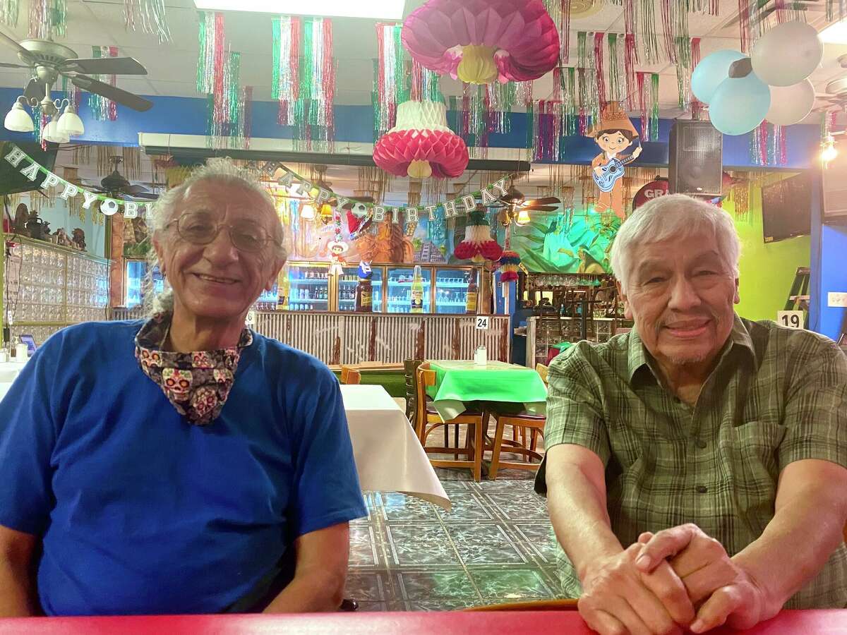 Manuel Garza (left) and Mario Compean (right) at Taqueria El Chilaquil on October 12, 2021.