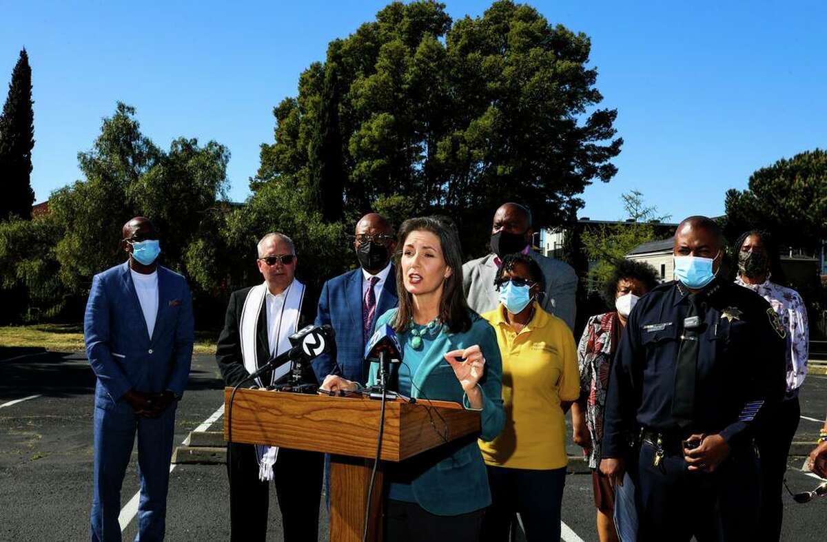 Oakland Mayor Libby Schaaf stands near LeRonne L. Armstrong, Chief of Police, Oakland Police Department, as she delivers remarks during a press conference at Mount Zion Missionary Baptist Church on Tuesday, March 22, 2022, in Oakland, Calif.