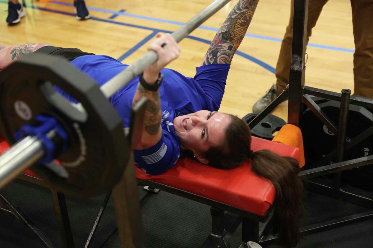 Shannon Cassinelli gets psyched up while competing in powerlifting at Joint Base San Antonio-Randolph on Tuesday. Wounded warriors were in trials for a chance to represent the Air Force at the 2022 Warrior Games in Orlando, Florida.