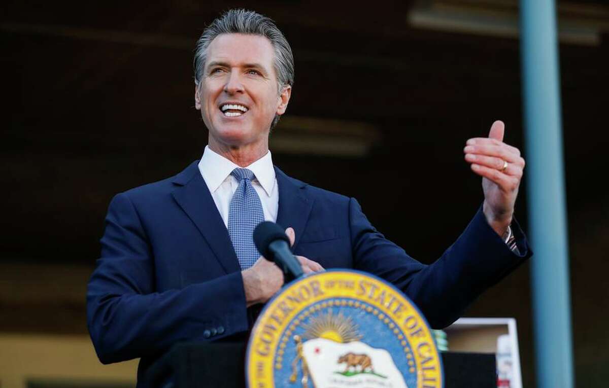 California’s budget surplus surged to $97.5 billion, bringing the state’s next budget to a record $300 billion, Newsom announced. Governor Gavin Newsom speaks at a press conference on Friday, Dec. 17, 2021 in Dublin, California.