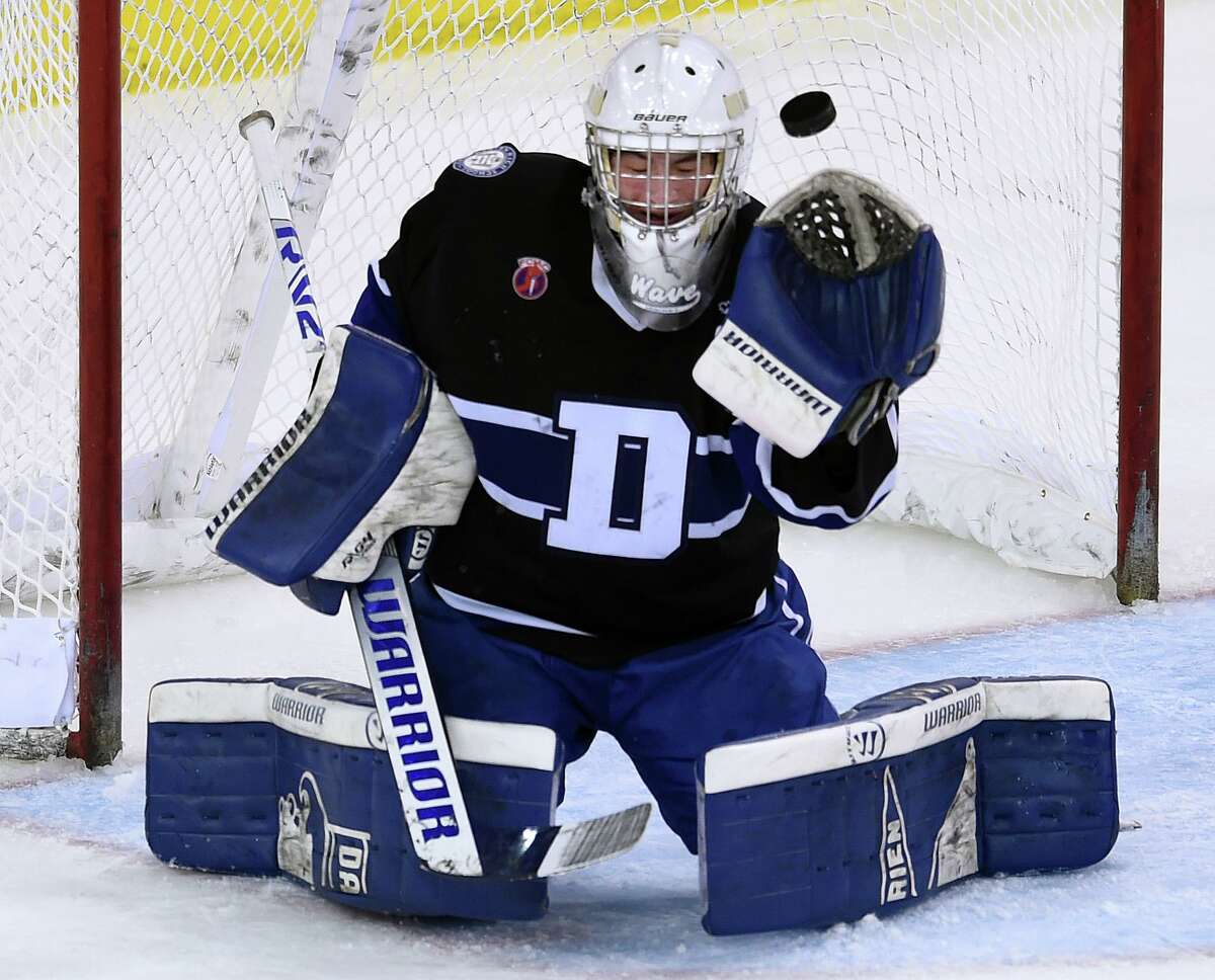 Notre Dame-West Haven scores past Darien goalie Chris Schofield in the second period of the CIAC Division 1 State Championship to tie the score at 1-1 at the People's United Center in Hamden on March 22, 2022