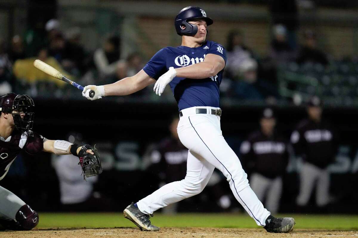 Rice’ Nathan Becker hits a 3-run double during the fourth inning of an NCAA college baseball game against Texas A&M, Tuesday, March 22, 2022, in Houston.