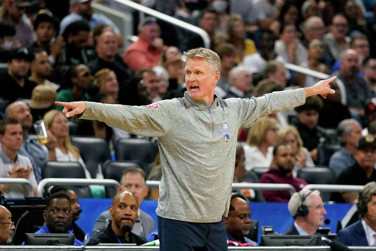 Golden State Warriors head coach Steve Kerr directs his team against the Orlando Magic during the second half of an NBA basketball game, Tuesday, March 22, 2022, in Orlando, Fla. (AP Photo/John Raoux)