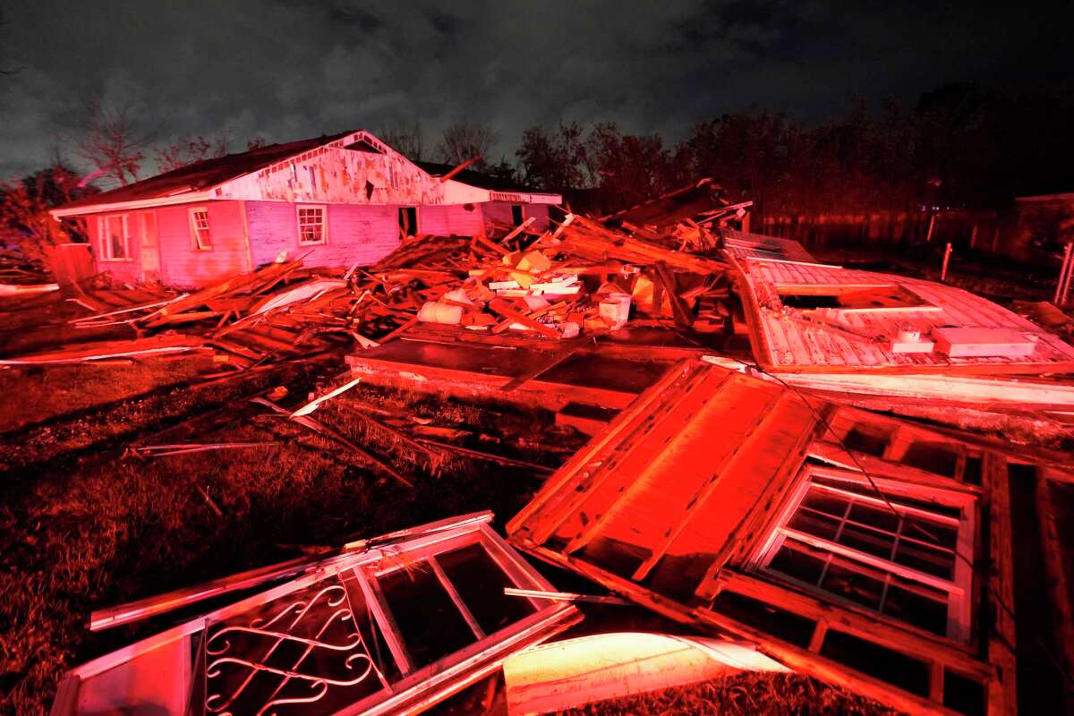 Destroyed homes, illuminated by fire engine lights, are seen after a tornado struck the area in Arabi, La., Tuesday, March 22, 2022. A tornado tore through parts of New Orleans and its suburbs Tuesday night, ripping down power lines and scattering debris in a part of the city that had been heavily damaged by Hurricane Katrina 17 years ago.
