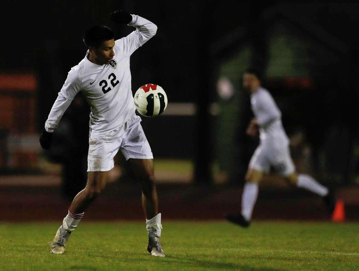 Conroe’s Rafael Ramirez (22) controls the ball in the second period of a high school soccer match at The Woodlands High School, Friday, March 11, 2022, in The Woodlands.