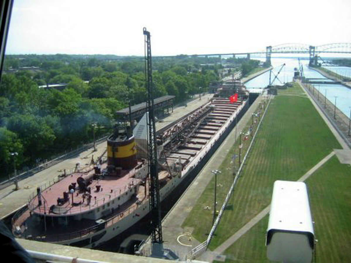 In this June 10, 2005 file photo, an ore ship passes through the Soo Locks in Sault Ste. Marie. Vessels large and small pass through the structures known as the Soo Locks more than 7,000 times a year. 