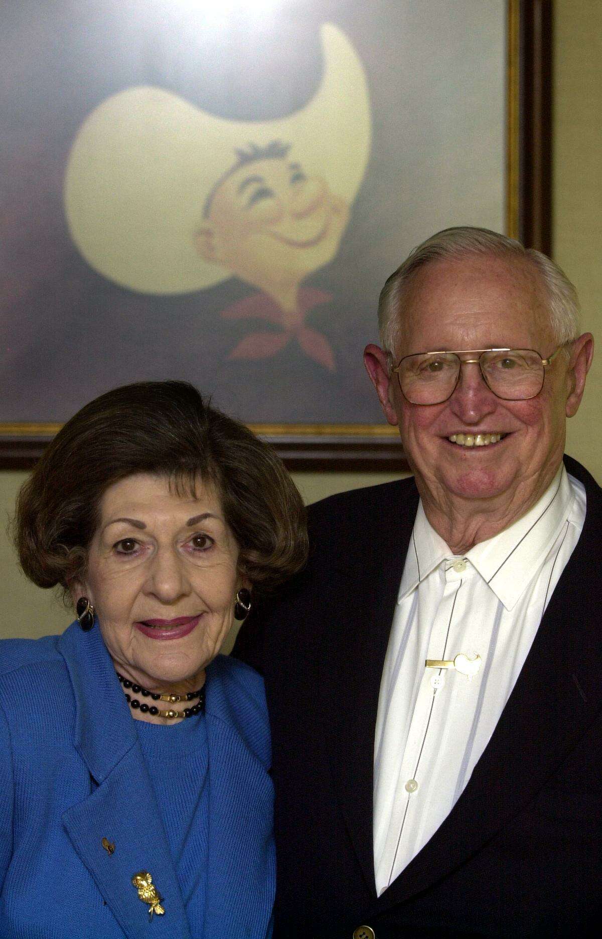 Jim and Veva Hasslocher stand in front of the Jim's Restaurants logo at Hasslocher Enterprises Inc.’s headquarters in 2002. She died in 2009; he died in 2015.