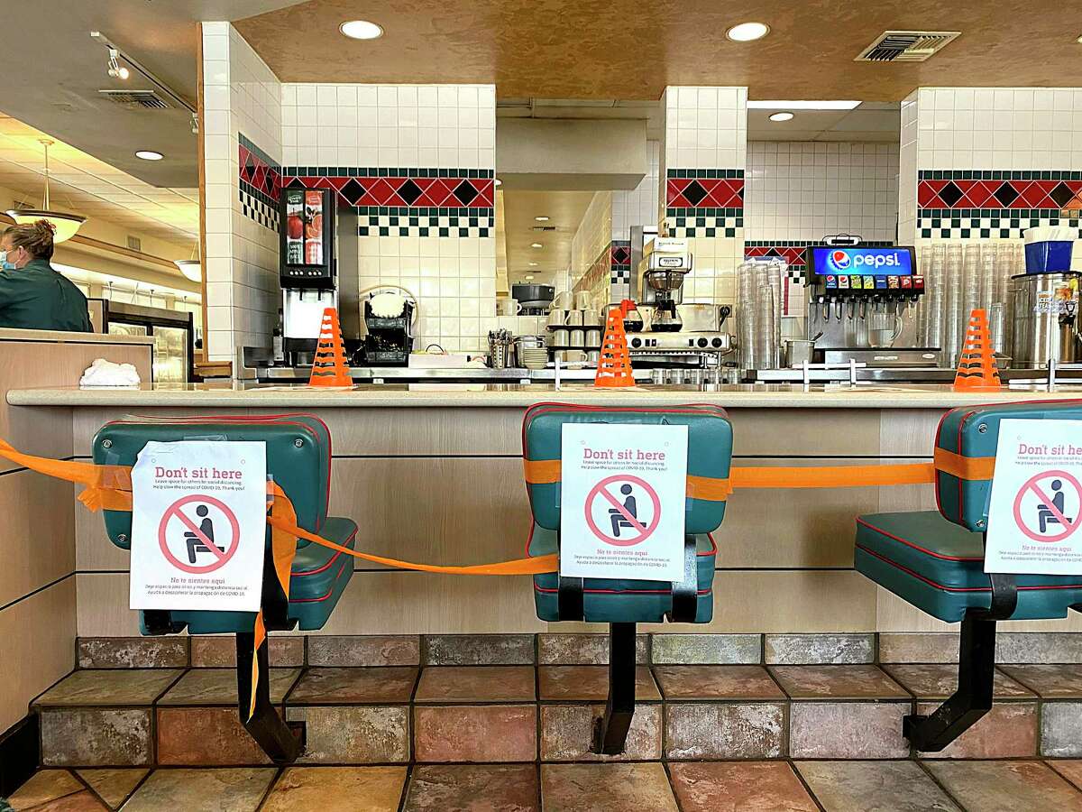 Seats at the counter at the Jim’s Restaurant at Blanco Road and Loop 1604 in San Antonio were off limits during the pandemic. Jim’s Restaurants have not been able to resume operating around the clock because of difficulty finding workers.