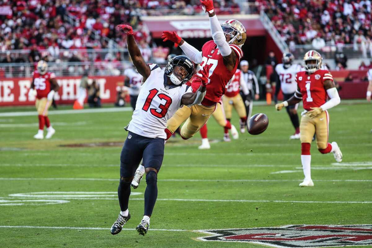 Houston Texans wide receiver Brandin Cooks (13) can’t come down with a catch as he is defended by San Francisco 49ers defensive back Dontae Johnson (27) during the fourth quarter of an NFL football game Sunday, Jan. 2, 2022, in Santa Clara, Calif.