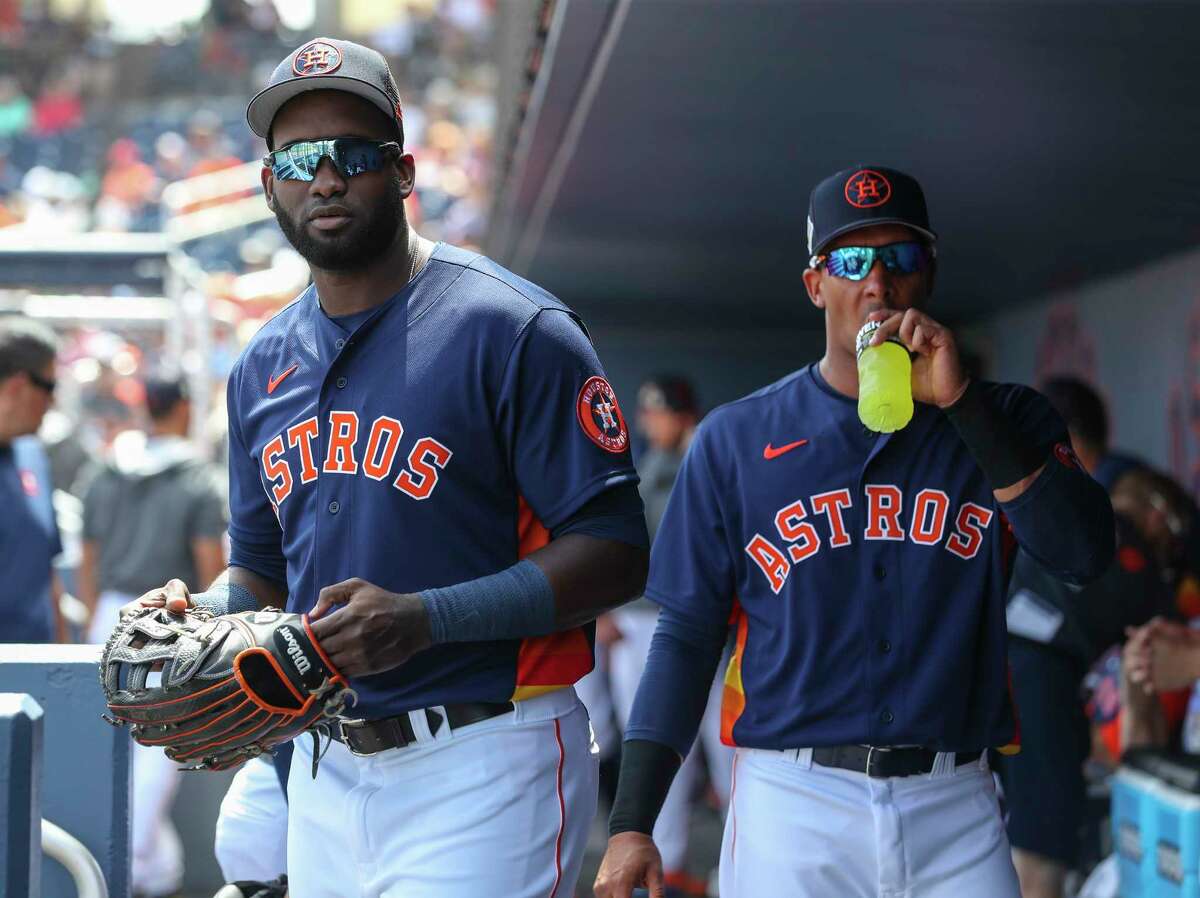 Houston Astros Yordan Alvarez (44) and Michael Brantley (23) in the dugout before the start of a MLB spring training game at The Ballpark of the Palm Beaches on Wednesday, March 23, 2022 in West Palm Beach.