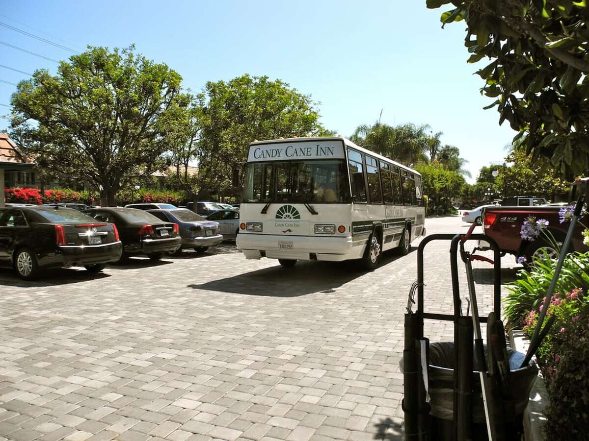 The Candy Cane Inn bus shuttles guests to and from the Disneyland Resort.