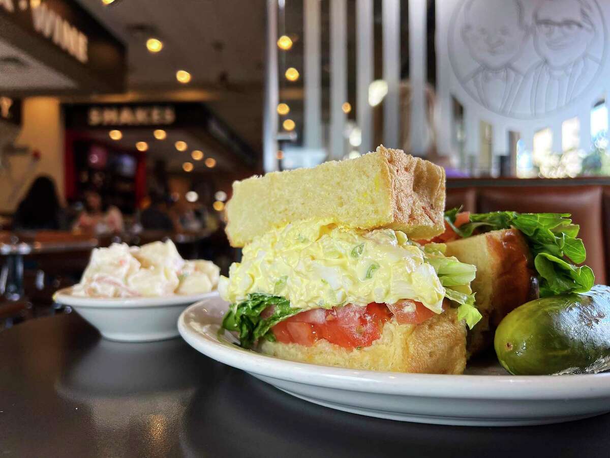 The egg salad gets piled high in a sandwich with house-baked challah bread at Max & Louie’s New York Diner.