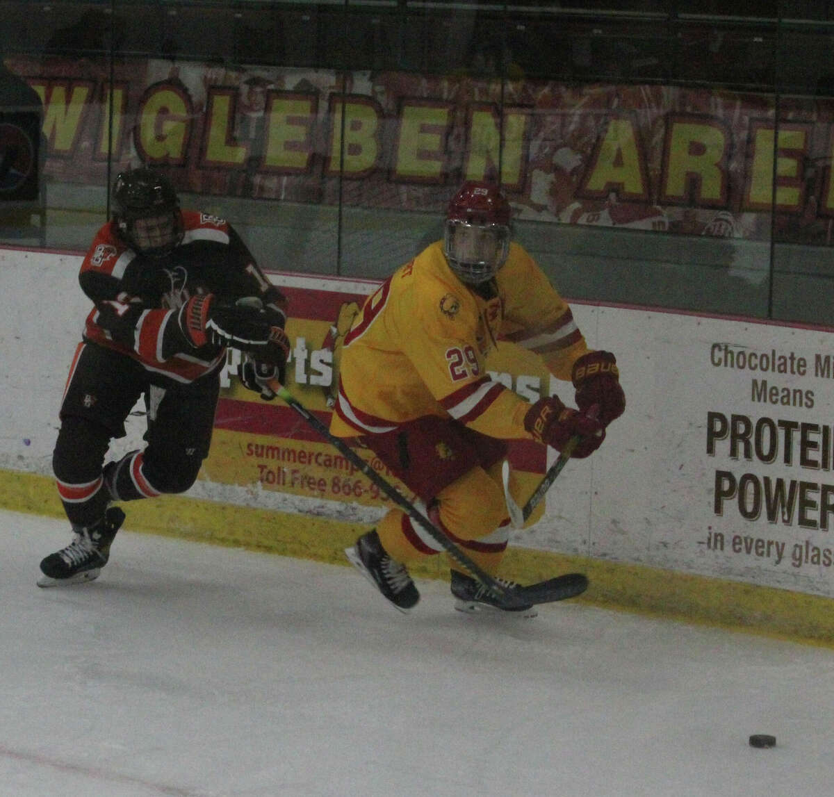 Ethan Stewart (right) played his college hockey at Ferris.