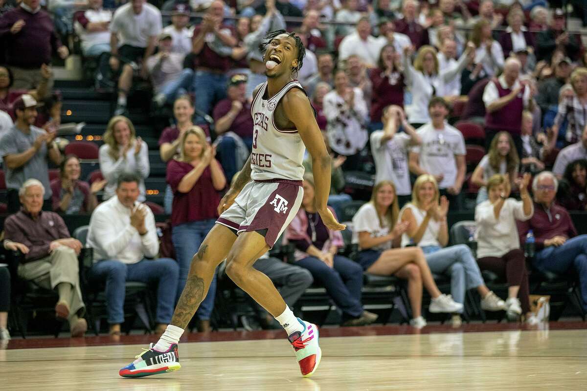 Texas A&M’s Quenton Jackson celebrates after a dunk during the first half of an NCAA college basketball game against Wake Forest in the third round of the NIT in College Station, Texas, Wednesday, March 23, 2022.
