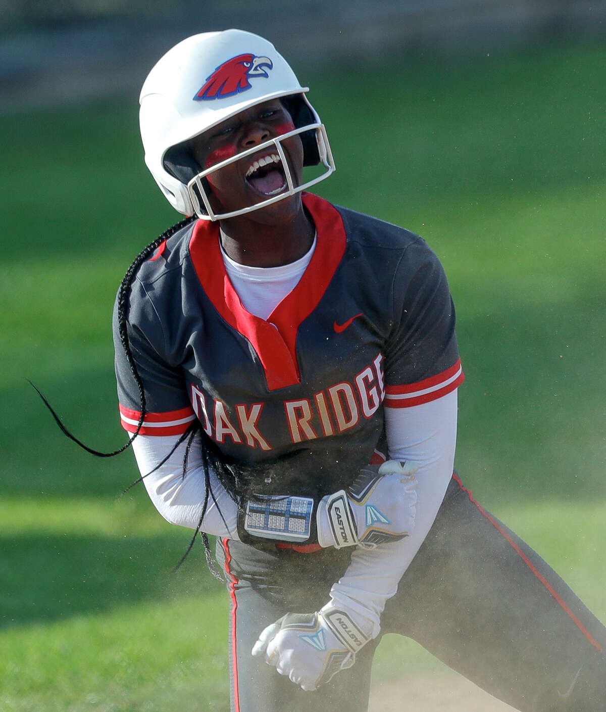 Ariel Redmond #1 of Oak Ridge reacts after advancing to third after an error by Conroe left fielder Madison Tomasek in the first inning during a District 13-6A high school softball game at Conroe High School, Wednesday, March 23, 2022, in Conroe.
